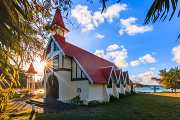 Cap Malheureux church in the village in Mauritius.  in the evening with light clouds in the sunset