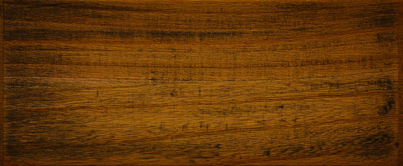 Naklejka premium Dark brown with remnants of black paint wooden background texture