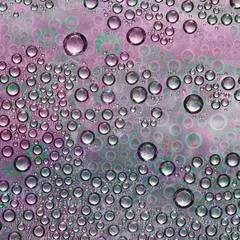 Spheres of different diameters pink and blue gray colors and their green reflections are randomly located on a motley background. Abstract fantasy. 