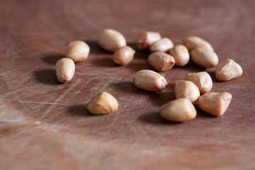 Raw Peanuts on wooden background