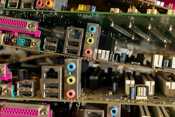 close up, old electronic motherboards from computers are lying in a pile