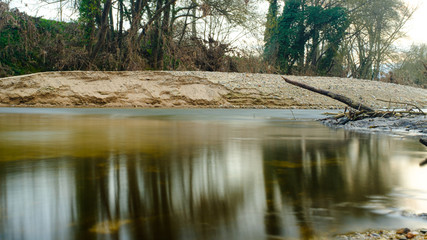 Long exposure water river on a winter landscape