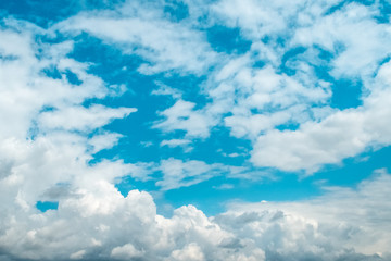 Naklejka na ściany i meble Blue sky background with soft clouds. Weather forecast concept.