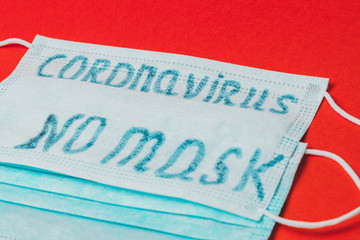 medical antiviral and antibacterial face mask with no masks, coronavirus on red background