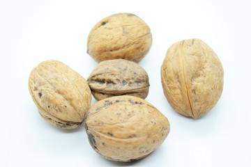 Beautiful ripe walnuts, located on a white background