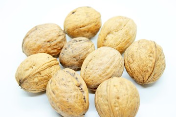 Beautiful ripe walnuts, located on a white background