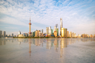 Shanghai city skyline Pudong side looking through Huangpu river on a sunny day. Shanghai, China. Beutiful vibrant panoramic image.
