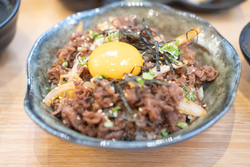 Japanese beef bowl with onion and soy and put egg on top