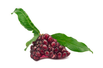 Ripe fresh juicy tropical POMEGRANATE fruit seeds with leaves isolated on white background. Full dept of field. 