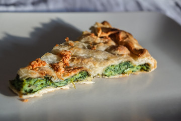 Savory pie with vegetables, closeup . Italian food name is : Erbazzone