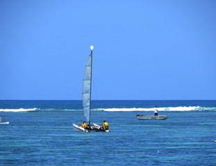lonely sailing yachts in the Indian Ocean at the equator 