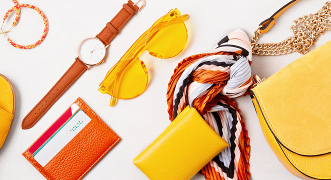 Flat lay with woman fashion accessories in yellow colors. Fashion, online beauty blog, summer style, shopping and trends idea