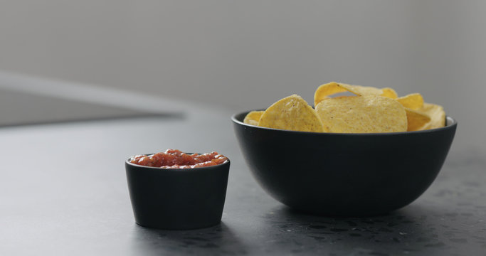 Serve Corn Chips With Salsa On Concrete Surface