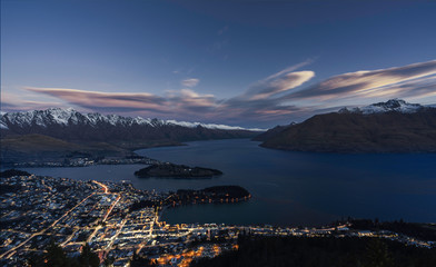 View of Queenstown city centre skyline, lake wakatipu and remarkable peak from above in the evening, south island, New Zealand