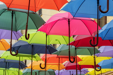 Colorful umbrellas roof over the city street