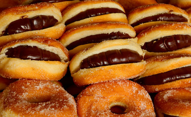 tasty donuts filled with chocolate in a pastry shop
