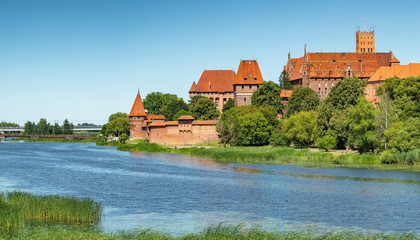 Naklejka na ściany i meble Teutonic Castle in Malbork or Marienburg at summer in Poland