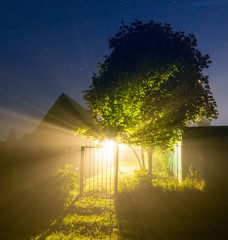 Country house at night in the fog. - 328831238