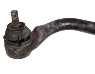 Out-of-service one rusty tie rod end with old cut rubber, isolated on white background
