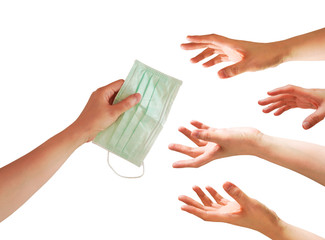 A hand give a face mask with many hands try to grab or capture , shortage or surging high demand of...