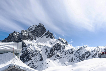 Close up of snow mountain with bright blue sky