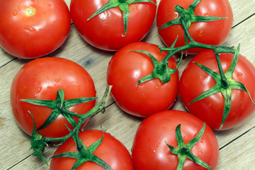 Tomatoes on a wooden table. Healthy, vegetarian food. Natural food.Vegetables on a table. Flat lay.