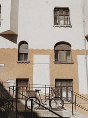 Fototapeta na wymiar Lonely bicycle against vintage building. Adventure, journey, travel concept. Sunny day.