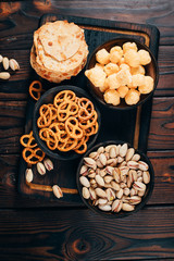 Set of beer snacks. Crackers, cheese balls, pretzels and nuts. Bar table. Restaurant, pub oktoberfest food