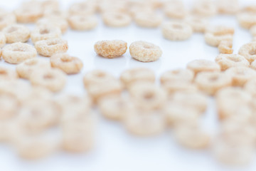 Fototapeta na wymiar Closeup Oat Cereal rings isolated on white background. Healthy breakfast concept