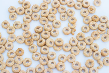Oat Cereal rings isolated on white background top view. Abstract background of cookies