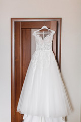Fototapeta na wymiar Elegant and luxurious wedding dress. Lace and ivory gown. Bridal outfit close up