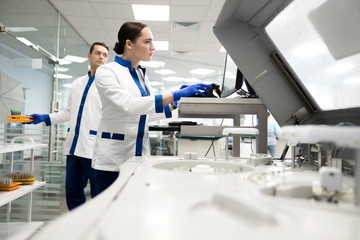 Research scientists working in laboratory with modern equipment