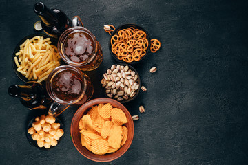 Beer, salted nuts and crunchy snacks. Oktoberfest food, pub special offer, party concept