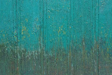 green gray wooden texture from old dirty boards in the fence wall on the street