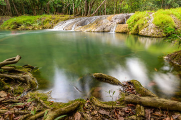 A beautiful stream water famous rainforest waterfall in Thailand