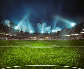 Football stadium with the stands full of fans waiting for the night game - obrazy, fototapety, plakaty