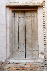 Traditional old wooden door. Itchan Kala (old or inner town), Khiva (Xiva), Uzbekistan.