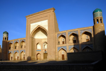 Facade of Kutlug-Murad-Inaka Madrasah (1804–1812), Itchan Kala (old or inner town). Khiva town, Uzbekistan.