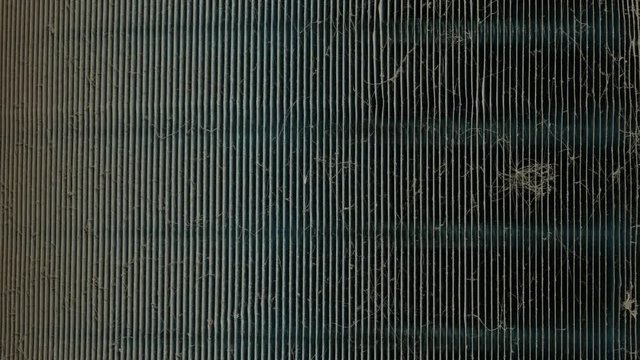 Camera movement shot of air conditioning heat sink is dirty with dust. Scene is out of focus to focus.