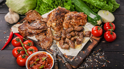 Food banner. Assorted kebabs of lamb and chicken. Food still life with meat, sauces, vegetables, herbs and spices.