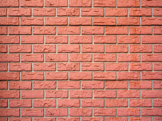 Wall of curly relief decorative red brick