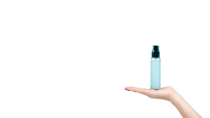 Face cream in glass bottle with dispencer. Blue container.