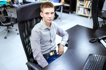 Young manager working in office. Internship in call center. HR department. Manager is calling.