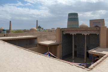 Fototapeta premium View at Itchan Kala (old or inner city), Kuhna Ark palace (fortress) and Kalta-minor Minaret. Khiva, Uzbekistan, Central Asia.