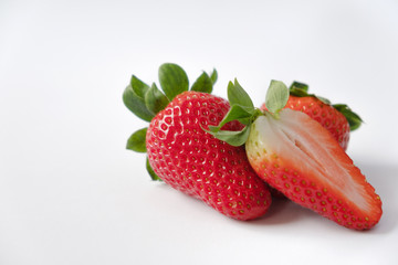 Strawberries with strawberry leaf on white background