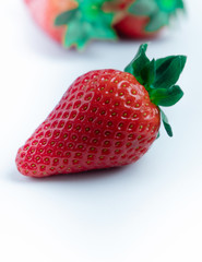 Strawberry with strawberry leaf on white background