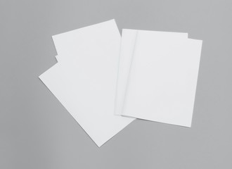 Blank portrait A4. Mock-ups white paper isolated on gray background. can use banners magazine products business texture newspaper.