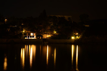Fototapeta premium Night view of Paleokastritsa bay. Night scenic view of Paleokastritsa Bay - Platakia Beach.