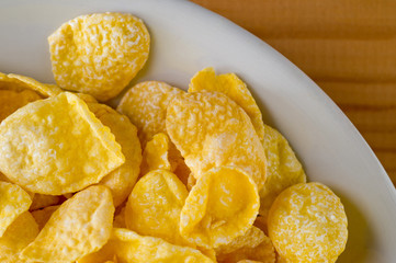 Glazed cornflakes. Breakfast cereals. Background for healthy eating and vegetarianism.