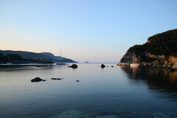 Landscape with Paleokastritsa Harbor. Sunrise view of the enter of Paleokastritsa harbor.